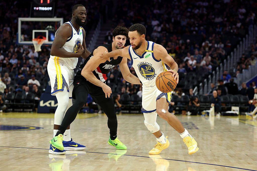 Stephen Curry #30 of the Golden State Warriors is guarded by Deni Avdija #8 of the Portland Trail Blazers during the second half of their preseason game at Chase Center on October 16, 2026 in San Francisco, California.