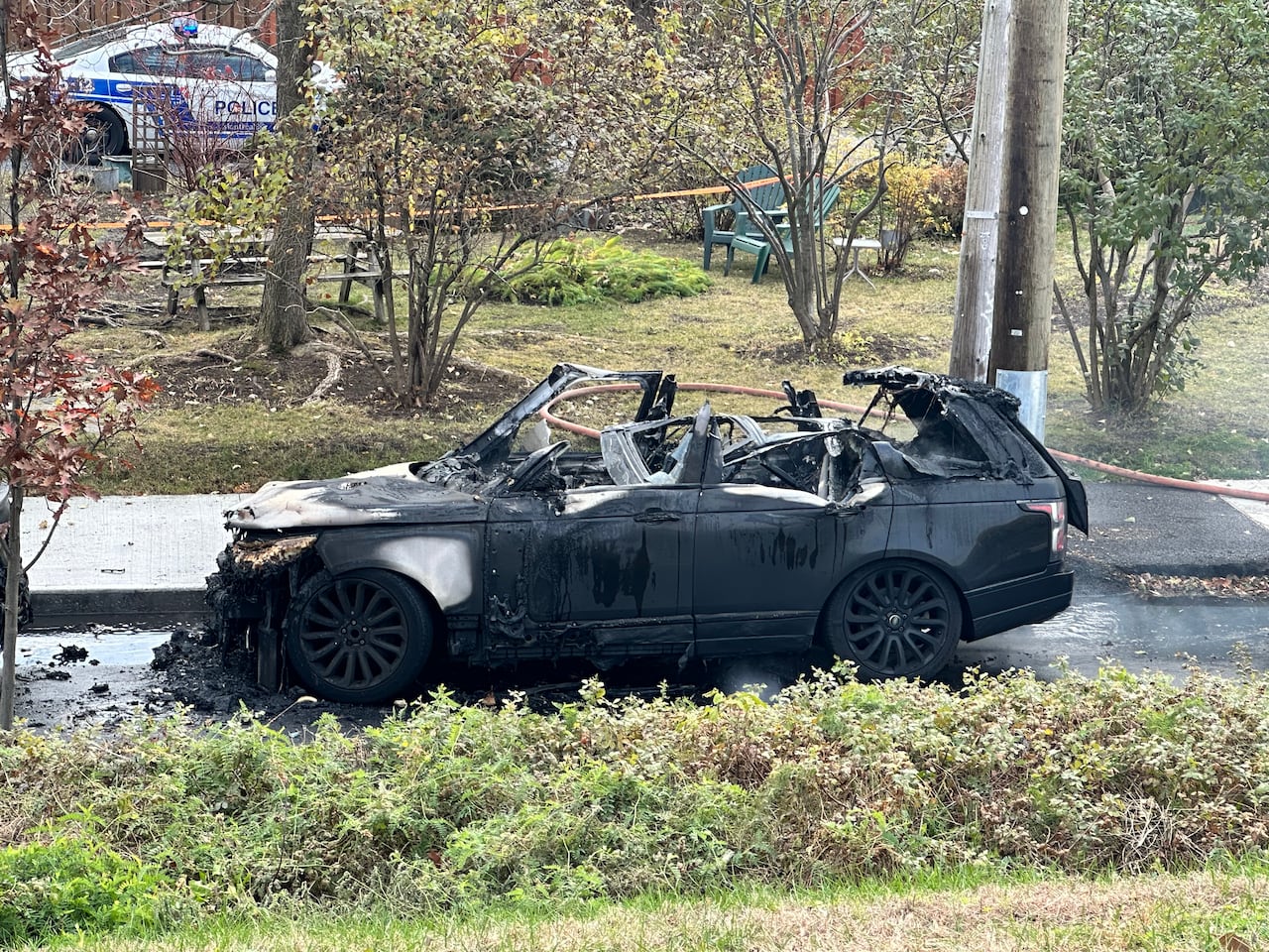 a charred black SUV