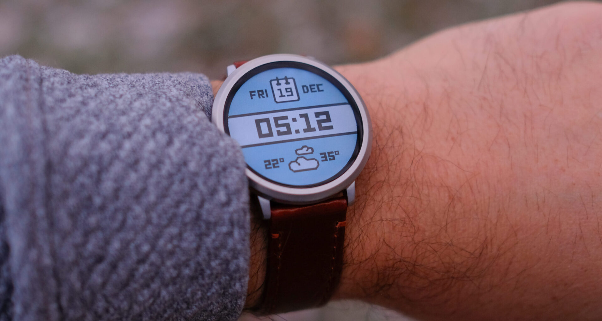 Lifestyle photo of someone wearing a Pebble Round 2.