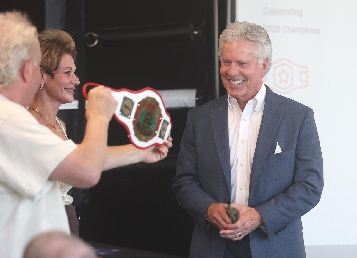 The Good Fight Parkinson's executive Chip Wiseman and founder Donna Clervi, from left, recognizes Dave Stauffer.