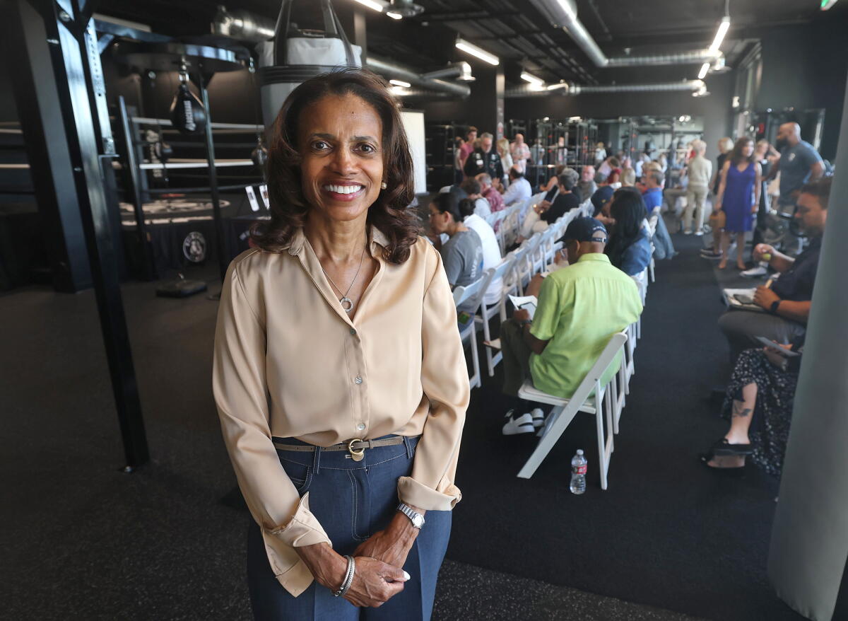 The Good Fight Parkinson's client and boxer Judy Fisher stands in the Rock Haus Fitness location in Lake Forest on Oct. 16.