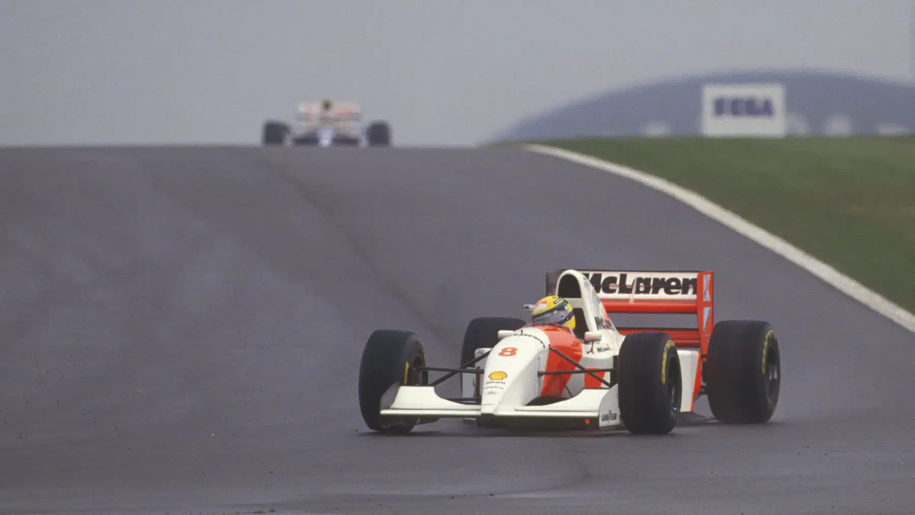 Ayrton Senna (McLaren-Ford) leads Alain Prost (Williams-Renault) in the wet 1993 European Grand Prix