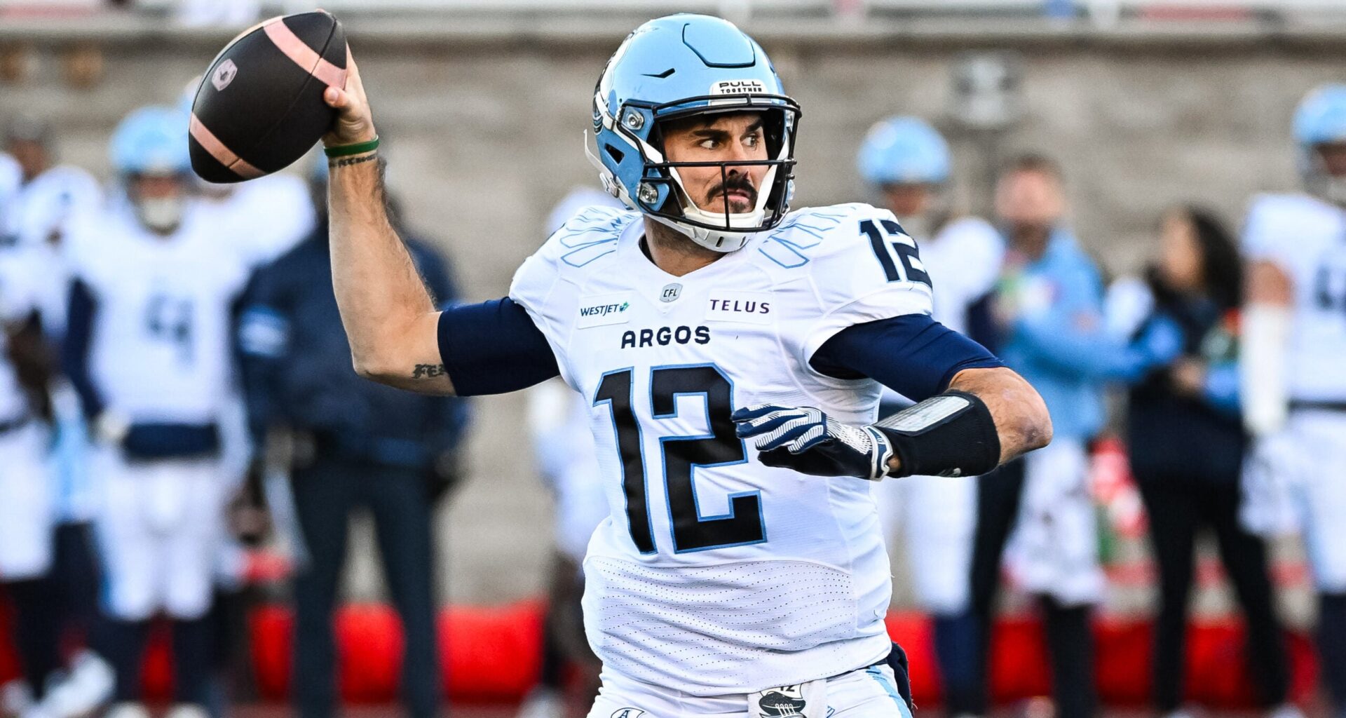 Nov 9, 2024; Montreal, Quebec, CAN; Toronto Argonauts quarterback Chad Kelly (12) passes the ball against the Montreal Alouettes during the first quarter at Percival-Molson Memorial Stadium.