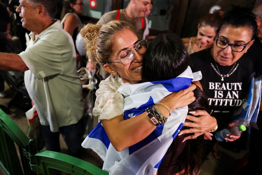 Passengers who were on the Flydubai aircraft bound for Israel from the UAE are greeted by friends and family as they arrive at Ben Gurion Airport near Tel Aviv on September 30.