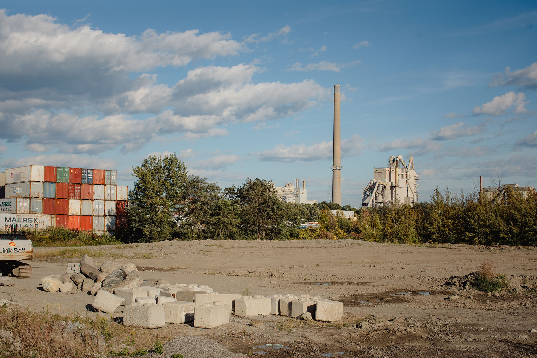 Left, residents walk between apartment buildings on Truscott Drive. Right, Mississauga Ward 2 contains the province’s largest cement plant, located along its southern border.