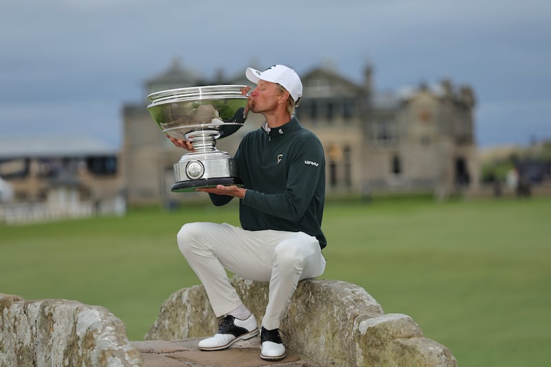 Adrian Meronk of Poland with his trophy on Swilcan Bridge after winning the Alfred Dunhill Links Championship 2026 at the Old Course at St Andrews. Photograph: Steve Welsh/PA Wire