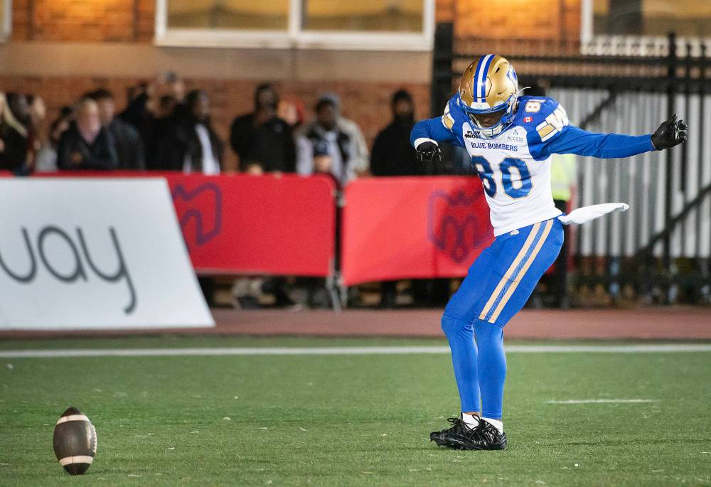 PETER McCABE / THE CANADIAN PRESS
Winnipeg Blue Bombers' Ontaria Wilson celebrates his touchdown against the Montreal Alouettes during first half CFL football action in Montreal on Saturday.