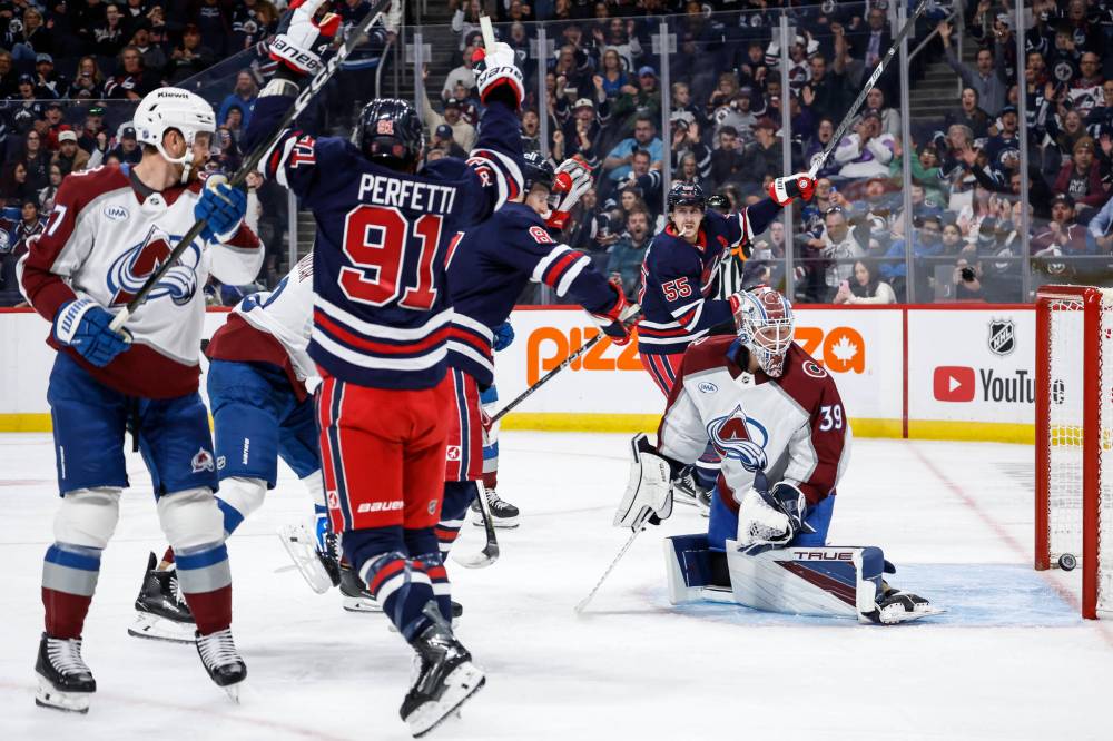 THE CANADIAN PRESS/John Woods
Cole Perfetti and Mark Scheifele celebrate Kyle Connor's goal on goaltender Mackenzie Blackwood in the second period, Wednesday.