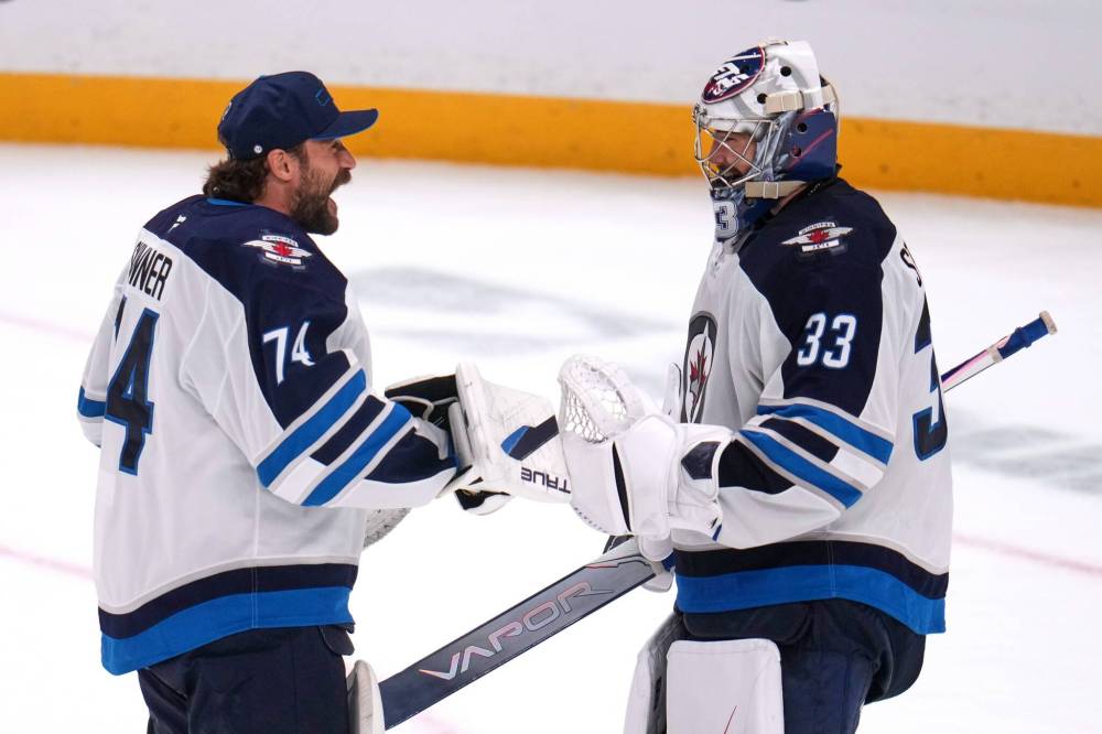 GENE J. PUSKAR / THE ASSOCIATED PRESS FILES
Winnipeg Jets goaltenders Clay Stevenson (right) and Stuart Skinner (left) have backstopped the club to a hot 4-1-1 start, giving the franchise time in their search for franchise netminder Connor Hellebuyck’s new hockey home.