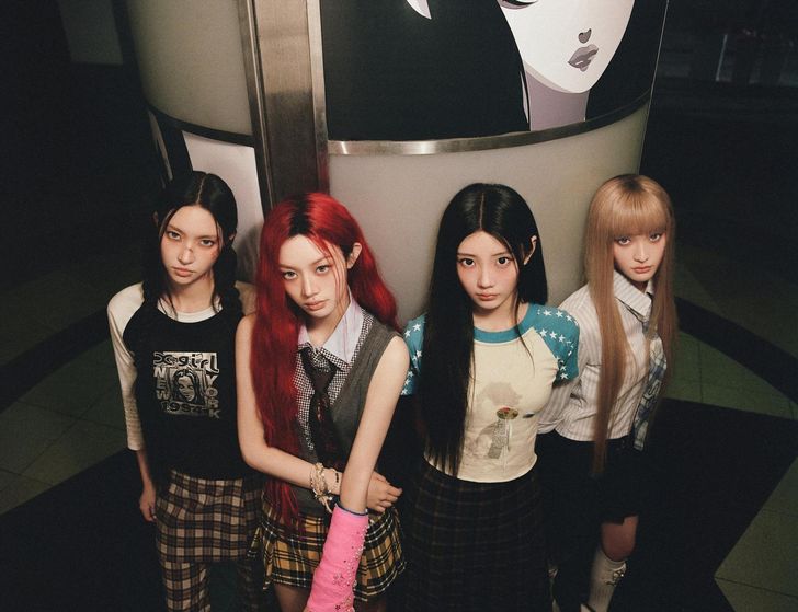 From left are K-pop girl group ILLIT members Yoona, Minju, Wonhee and Iroha. ILLIT has been active as a four-member group since June, when Moka halted activities to focus on her health. Courtesy of Belift Lab