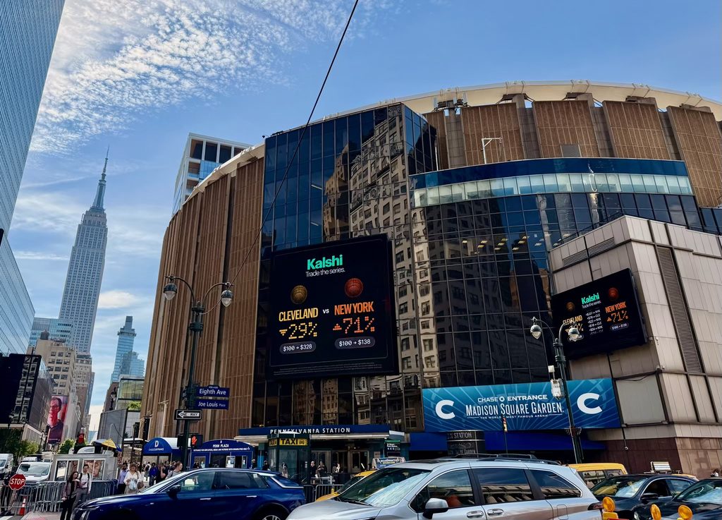 Madison Square Garden’s Penn Plaza corner at Eighth Avenue with the Empire State Building in view