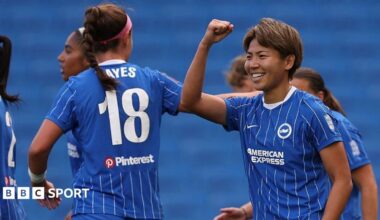 Brighton players celebrate scoring a goal