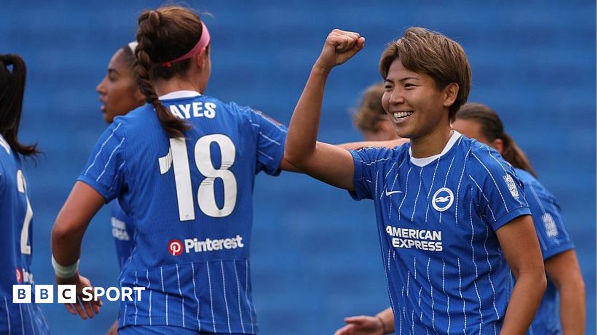 Brighton players celebrate scoring a goal