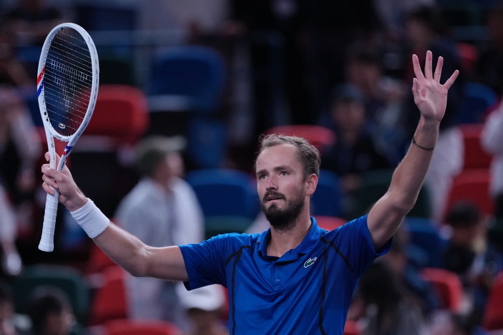 Daniil Medvedev, of Russia, celebrates after defeating Stefanos Tsitsipas, of Greece, in the fourth round of the men's singles match at the Shanghai Masters tennis tournament in Shanghai, China, Wednesday, Oct. 14, 2026. (AP Photo/Andy Wong)
