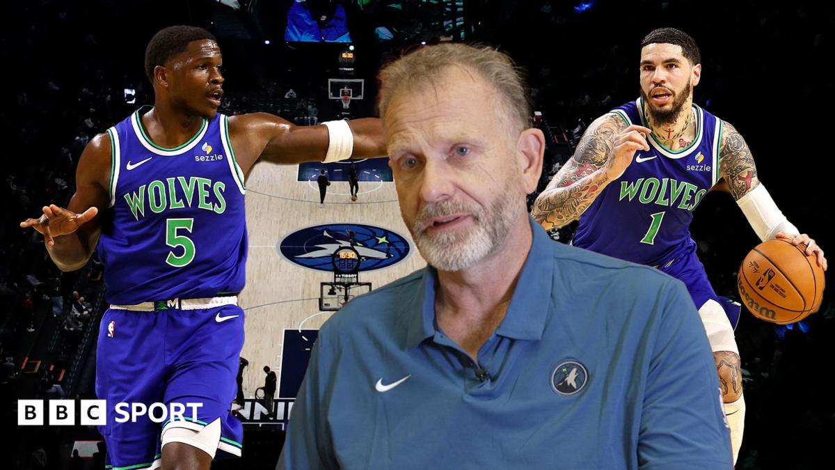 Tim Lewis with Anthony Edwards and LaMelo Ball behind him in front of the basketball court at the Target Centre