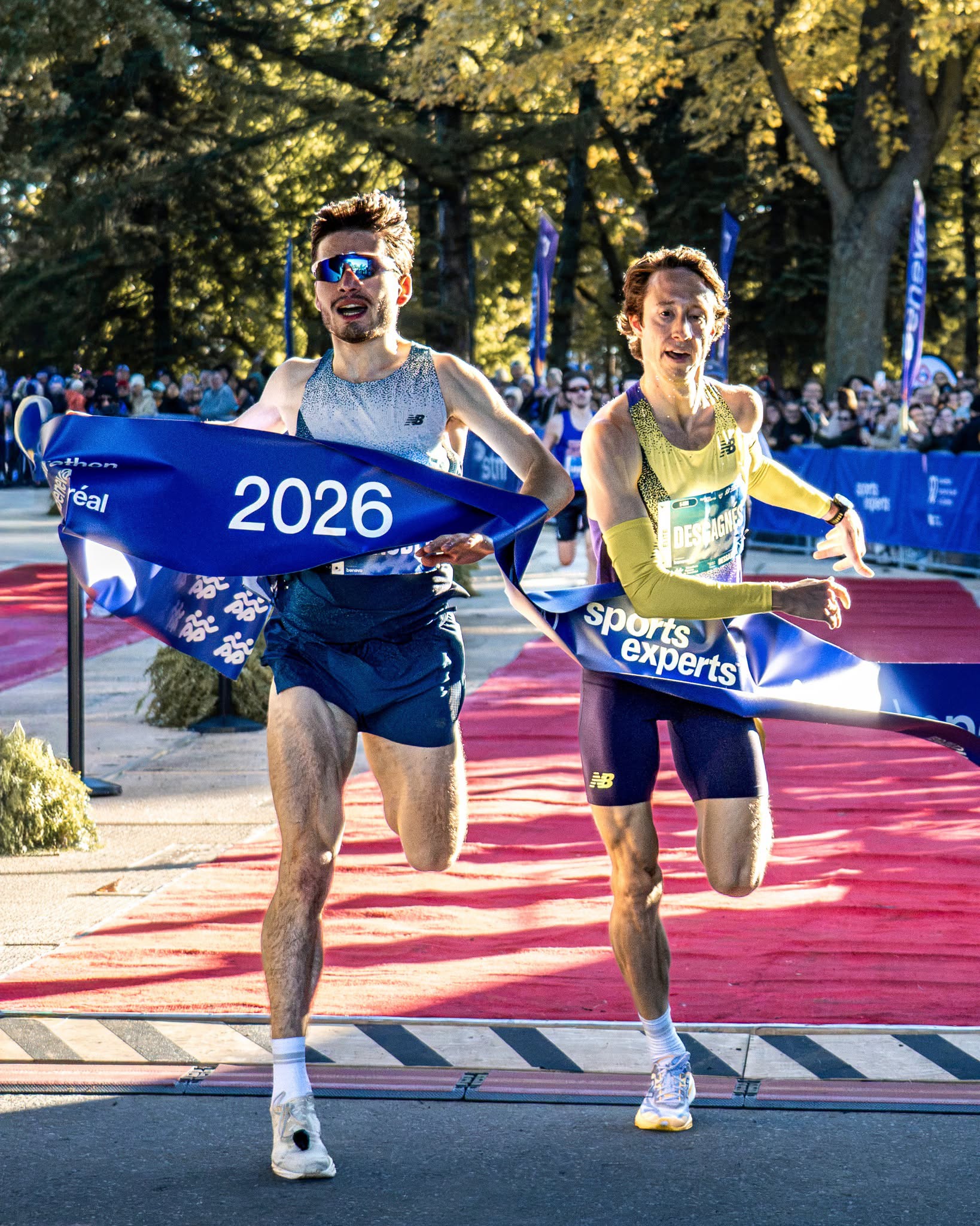 (from left) Matthew Beaudet and Jean-Simon Desgagnés cross the finishing line at the 2026 Canadian 5K Championships in Montreal
