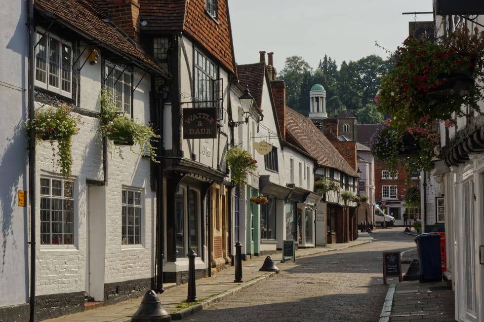 mixed architecture of old buildings in shopping street, godalming, surrey, england