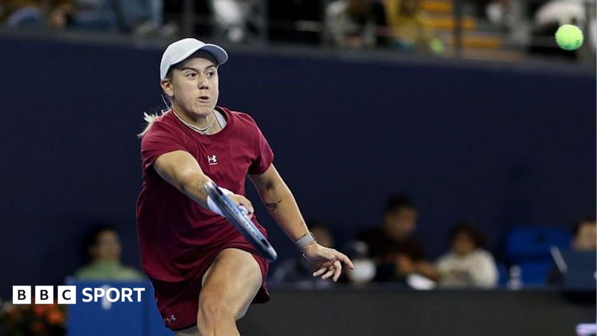 Sonay Kartal, in deep red tennis kit and white cap, plays a forehand shot at the Wuhan Open