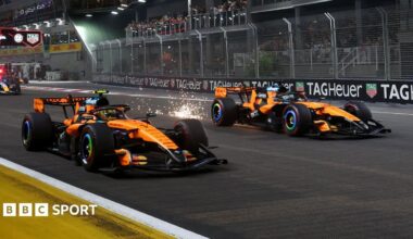 Lando Norris and Oscar Piastri move away at the start of the Singapore Grand Prix