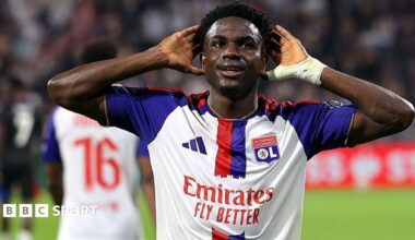 Ernest Nuamah celebrates scoring a goal for Lyon