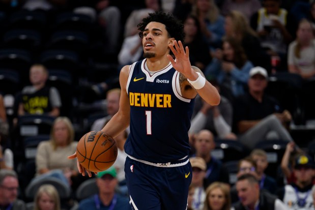 Denver Nuggets guard Julian Strawther sets the play during the second half of an NBA basketball game against the Utah Jazz, Tuesday, Oct. 6, 2026, in Salt Lake City. (AP Photo/Tyler Tate)