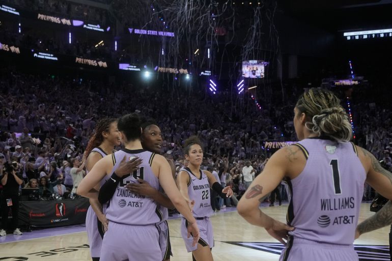 Golden State Valkyries center Kiah Stokes, from left rear, celebrates with forward Cecilia Zandalasini, guard-forward Kaila Charles, guard Veronica Burton (22) and forward Gabby Williams (1) after Game 1 of the WNBA basketball finals against the Atlanta Dream, Saturday, Oct. 17, 2026, in San Francisco. (AP Photo/Jeff Chiu)