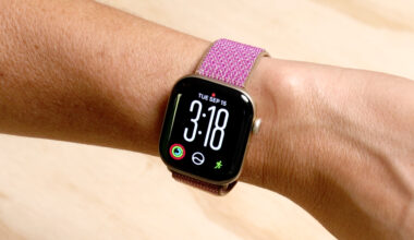 Apple Watch Series 12 with purple band on wrist.