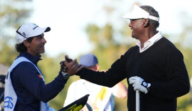Vijay Singh shakes hands with his caddie