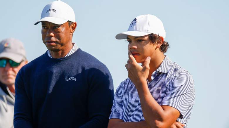 Tiger Woods talks with his son Charlie Woods while they play the second hole during the first round of the PNC Championship at Ritz-Carlton Golf Club on December 21, 2024 in Orlando, Florida