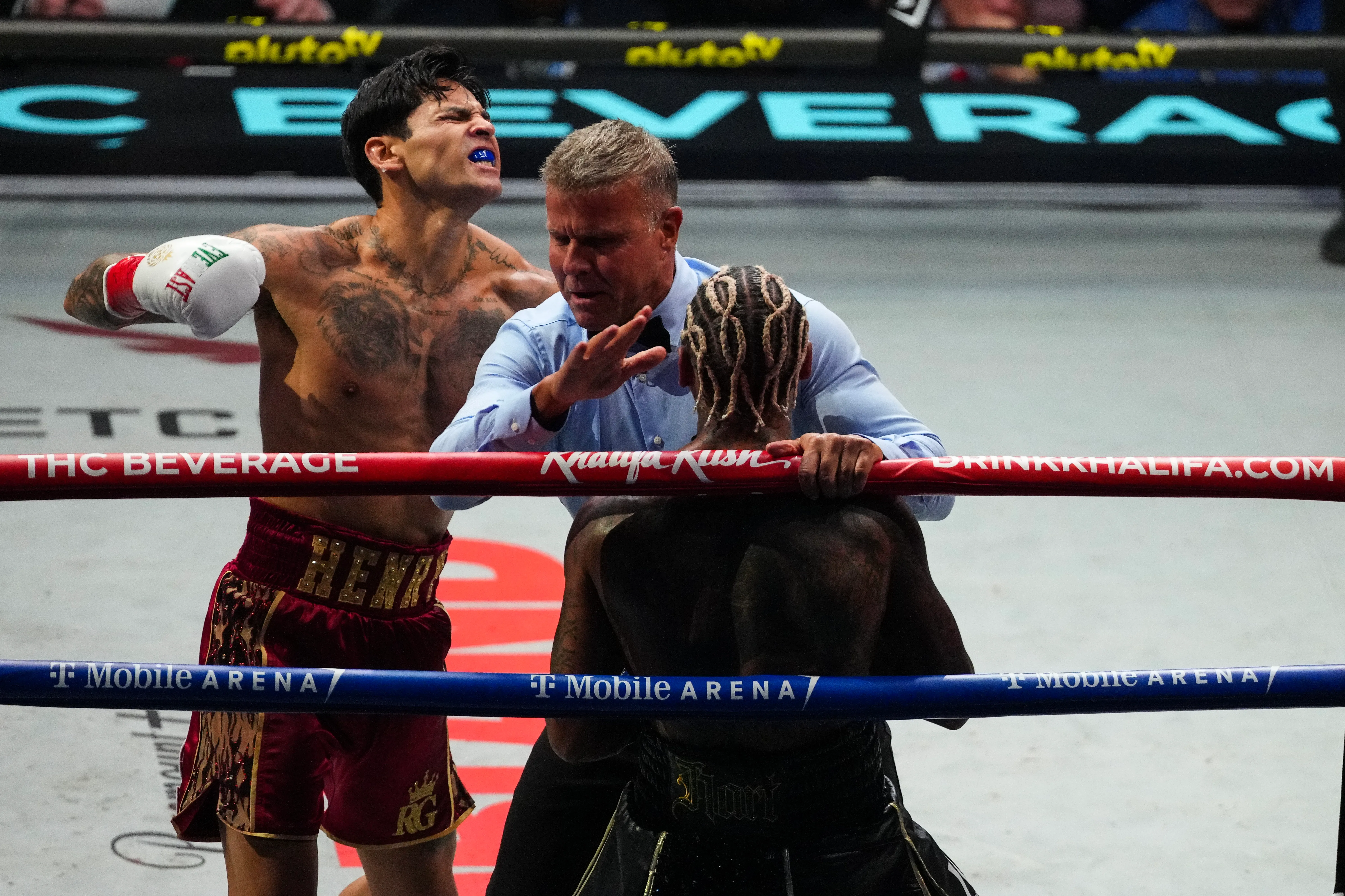 Ryan Garcia celebrates as Conor Benn is rescued in Las Vegas