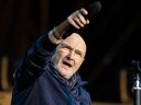 British singer Phil Collins performs on stage during his 