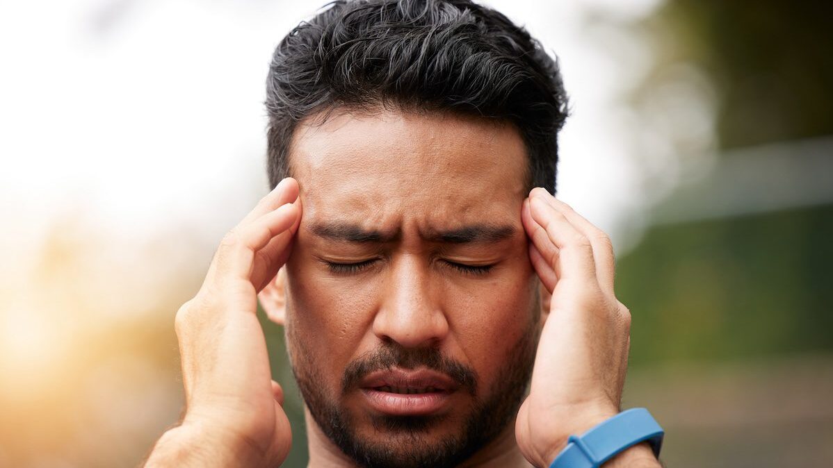 man with headache and pain