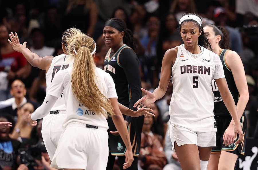 Angel Reese #5 of the Atlanta Dream reacts with Naz Hillmon #00 and Jordin Canada #3 after drawing a foul on a basket against the New York Liberty during the fourth quarter of game one of the semifinals of the WNBA playoffs.