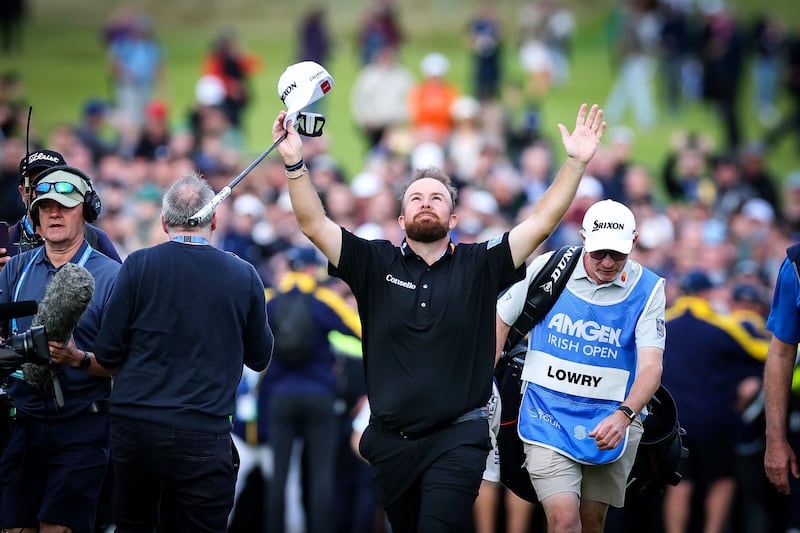 Shane Lowry celebrates as he walks up to the 18th green at the Amgen Irish Open in Doonbeg. Photograph: Dan Clohessy/Inpho