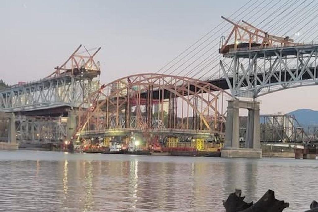 PHOTOS: Pattullo Bridge’s familiar orange arch taken down for recycling
