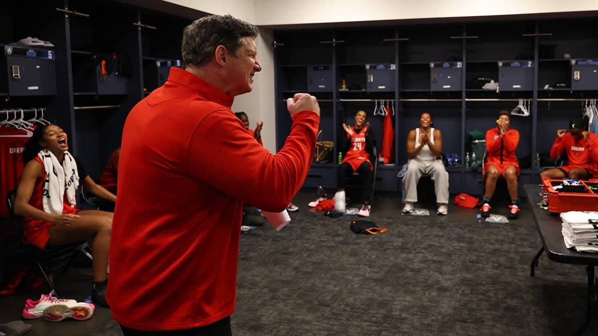 Karl Smesko celebrating after an Atlanta Dream win