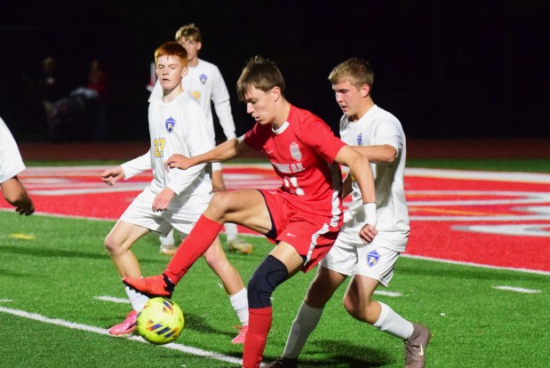 Senior Carson Twiner (red) scored one of the two goals for Grosse Ile in its 2-0 win over Ida on Oct 21, 2026. (ALEXANDER MULLER -- MediaNews Group)