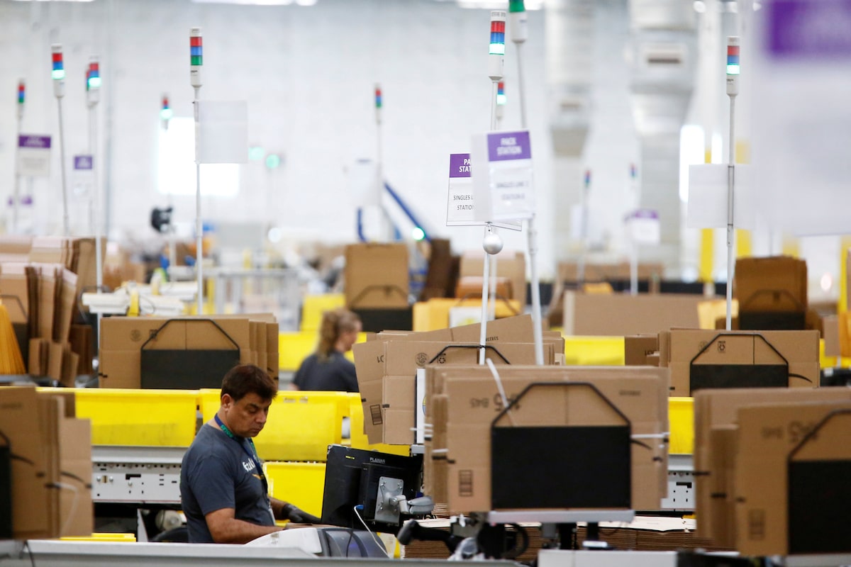 U.S. business activity cools in October as strong demand fuels inflation pressures