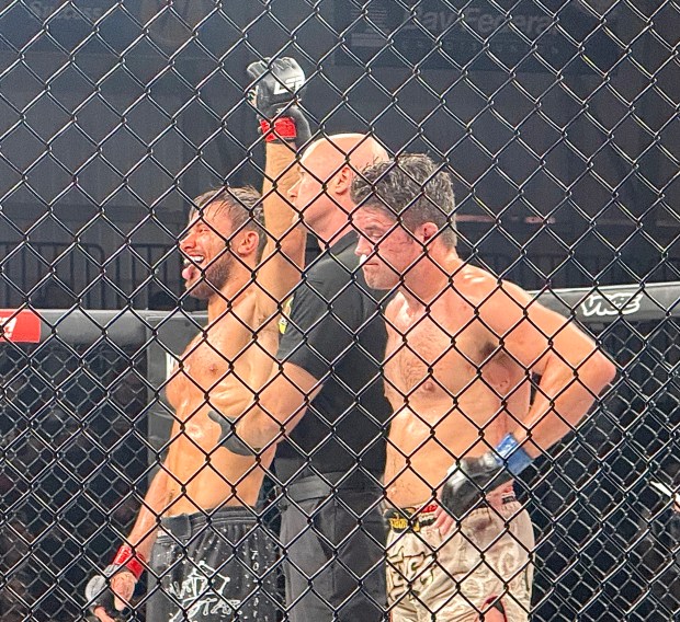 Scotts Valley's Jacob Horton, left, celebrates his win over Mark Lozano of San Antonio in their MMA catchweight bout at LFA 243 at KP Arena in Santa Cruz on Friday. (Jim Seimas - Santa Cruz Sentinel)