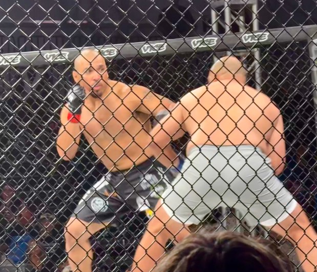 Santa Cruz native Lorenzo Figueroa, left, fights Helton José Jr., of Manacapuru, Amazonas, Brazil, in their MMA heavyweight bout at LFA 243 at KP Arena in Santa Cruz on Friday. (Jim Seimas - Santa Cruz Sentinel)