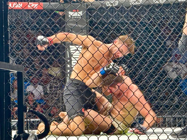 Scotts Valley's Jacob Horton lands a flurry of rights after he took down Mark Lozano of San Antonio in their MMA catchweight bout at LFA 243 at KP Arena in Santa Cruz on Friday. (Jim Seimas - Santa Cruz Sentinel)