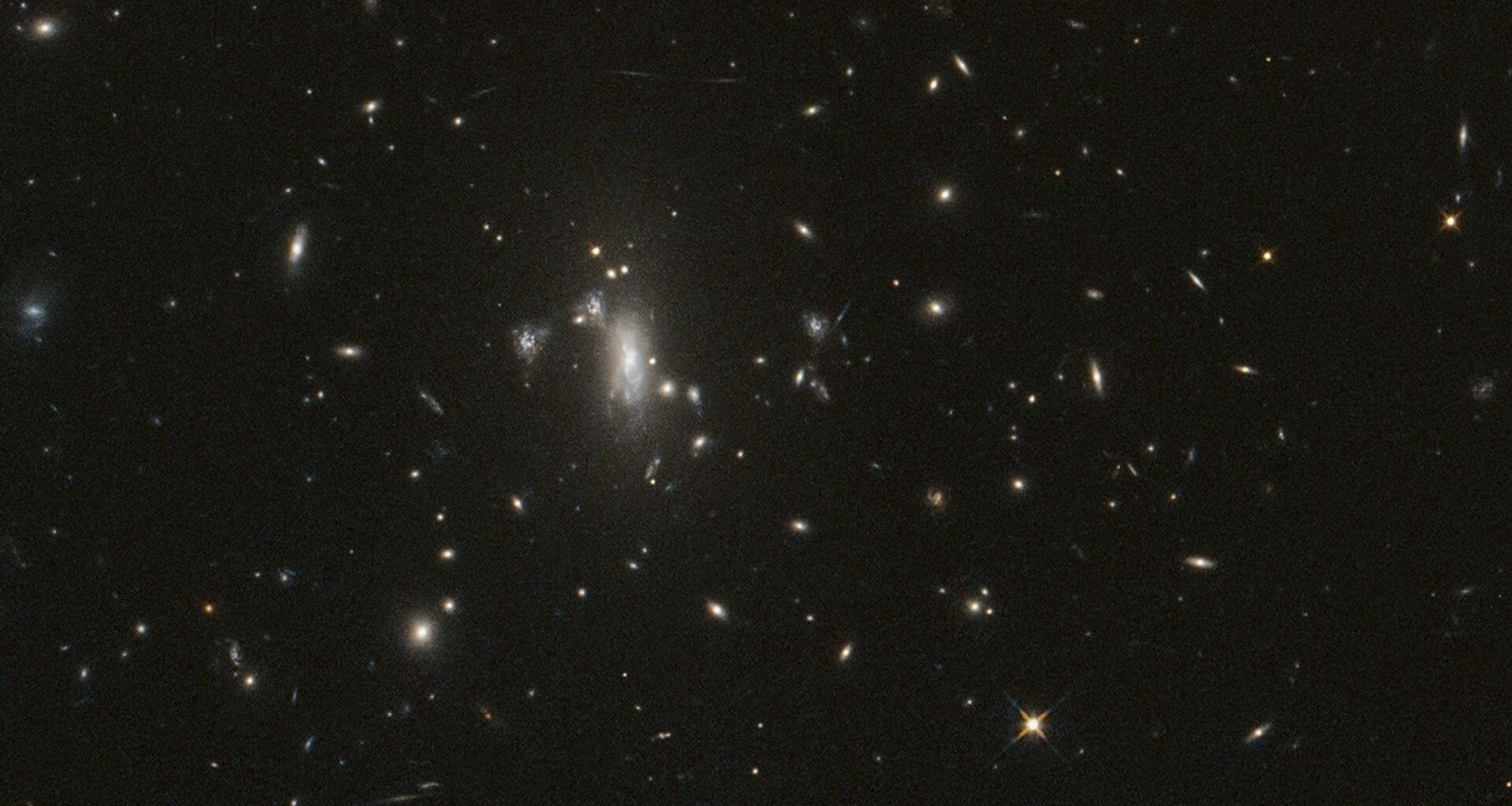 An image from NASA's Hubble Space Telescope of the galaxy cluster MACS J0417, part of repeated observations to monitor for the reappearance of supernova Athena. Credit: NASA/ESA/STScI/UCLA