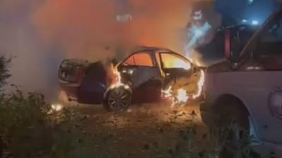 A car on fire at the residence of Narinder Singh Randhawa in Surrey late on Wednesday night. (CCTV Image)