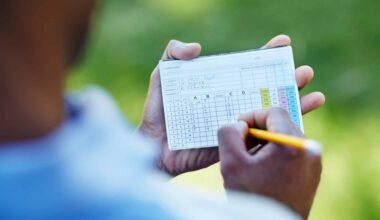 A player fills in a scorecard after a round