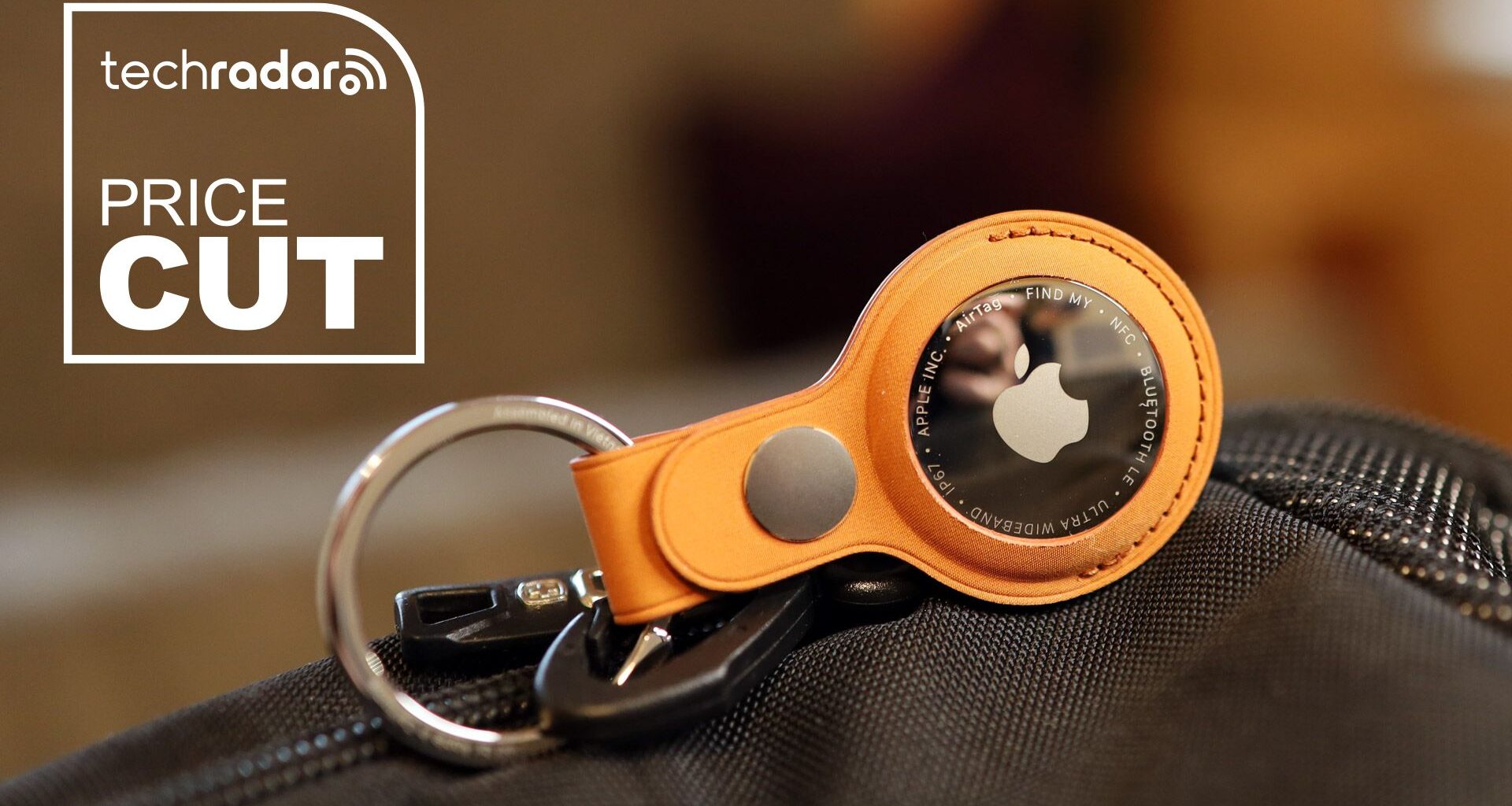 Apple AirTag 2 in a keyring holder, attached to a bag.