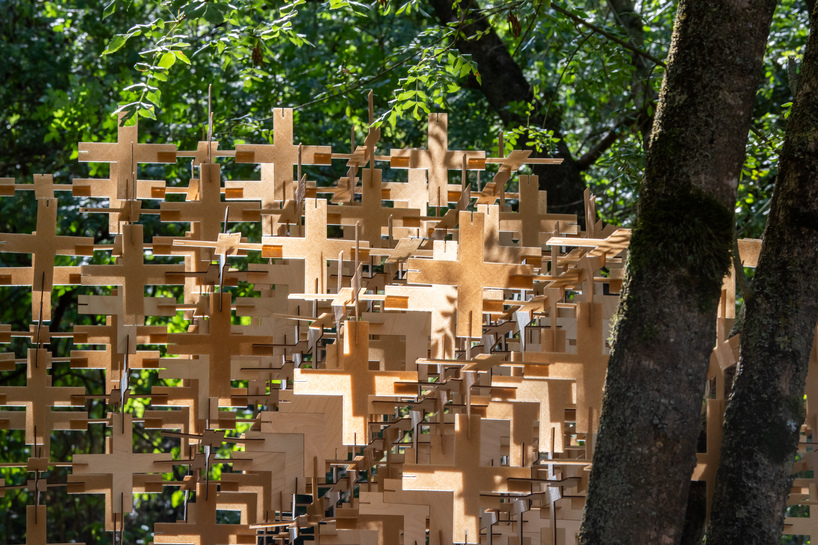 interlocking biodegradable modules weave regenerative pavilion into gavarres landscape - 1