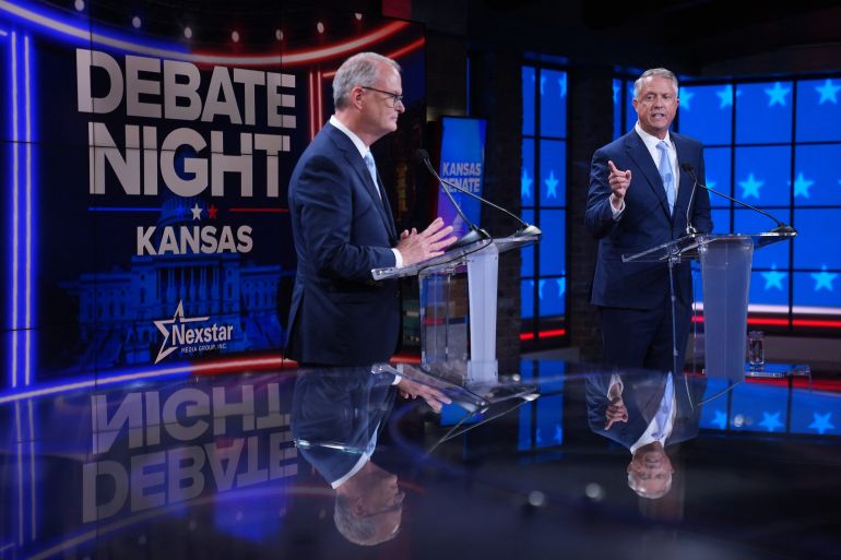 Democrat senatorial candidate Adam Hamilton (L) and US Senator Roger Marshall (R-KS) participate in a televised debate with at WDAF studios in Kansas City, Missouri, on October 21, 2026.