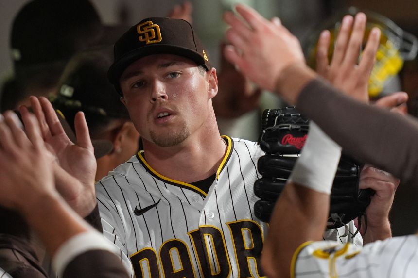 Miller celebrates with teammates in the dugout during a home game in San Diego last month.