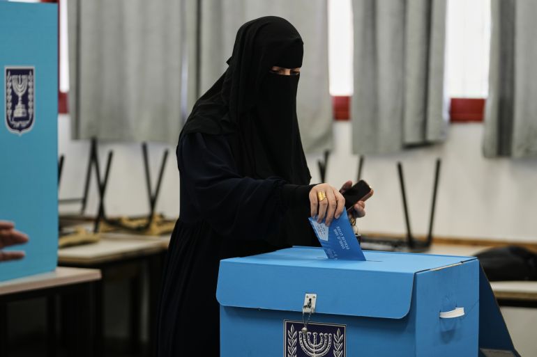 A Palestinian citizen of Israel casts her ballot in the country's general election at a polling station in Umm al-Fahm, Israel, Tuesday, Oct. 27, 2026. (AP Photo/Mahmoud Illean)
