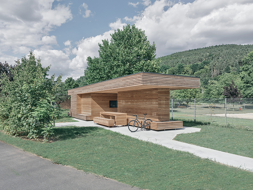 tob.studio’s timber bike station in germany resembles stacked log pile - 1